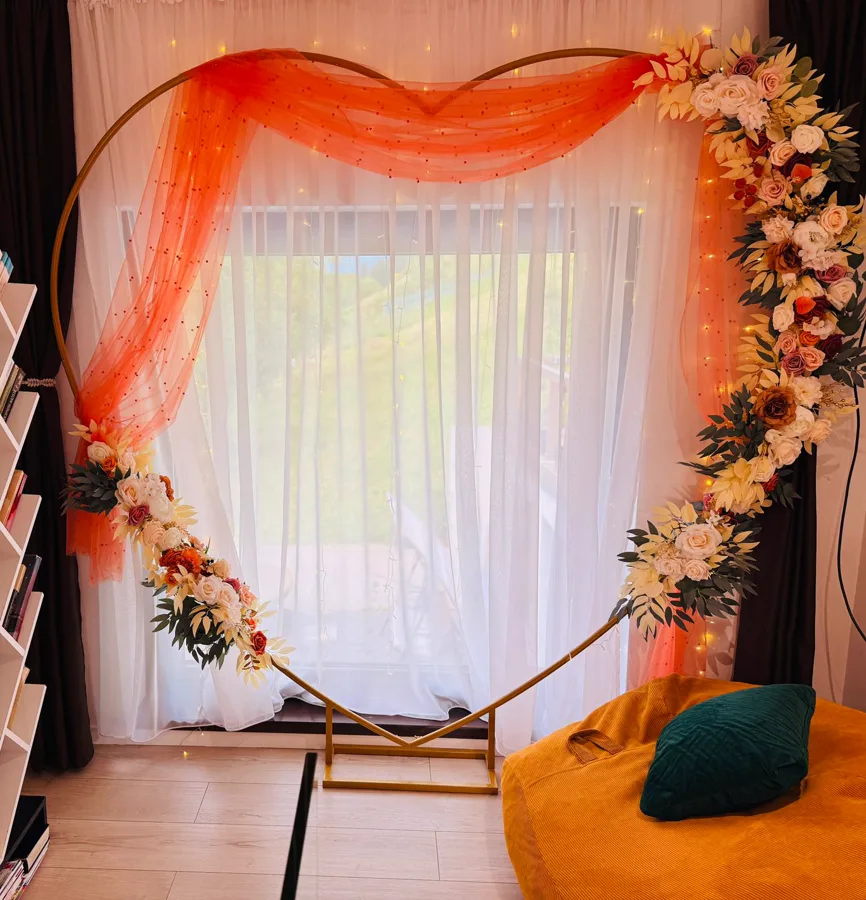 Interior décor with floral arch and golden yellow armchair